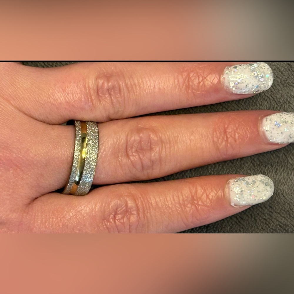 BN Stainless Steel Ring with Goldtone &
 Silver sparkle. 
Size 21